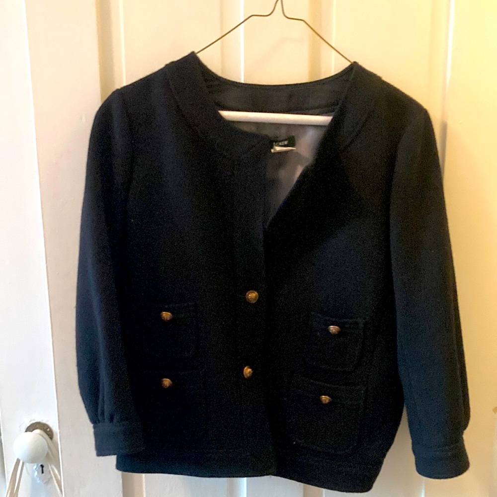 Black jacket with brass buttons